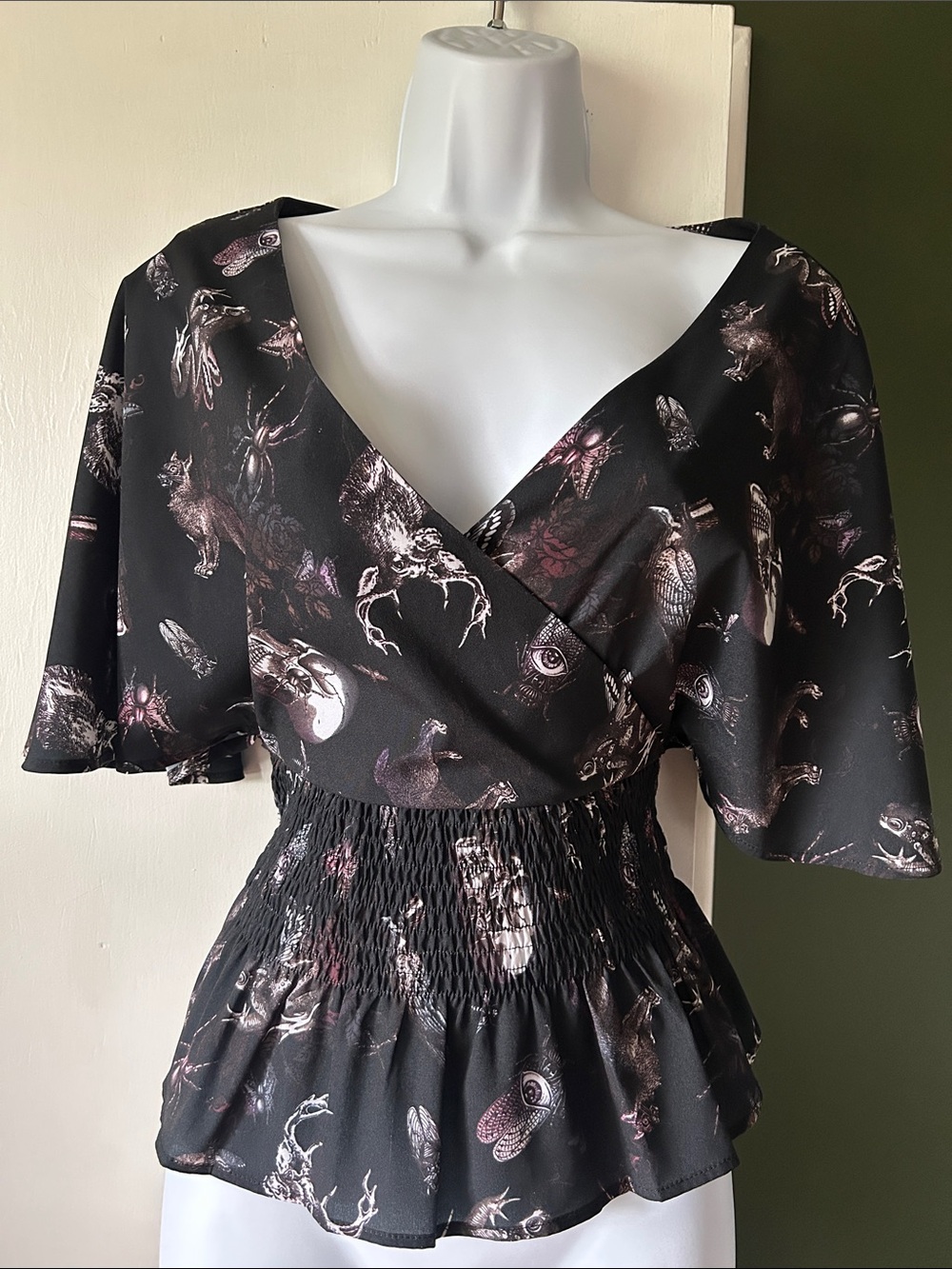 Spin Doctor - spooky curiosities flutter sleeve top